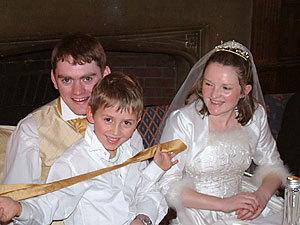 Couple with page at reception